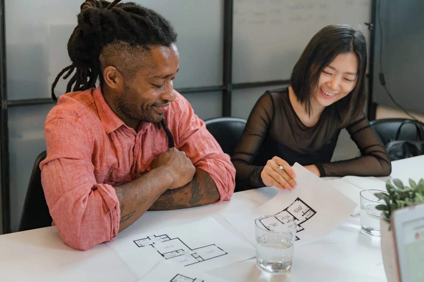 Architects reviewing a floor plan together at their studio table